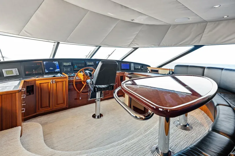 Yes Yacht Photos Pics Luxurious 2011 Westport yacht helm with wooden accents and modern navigation equipment.