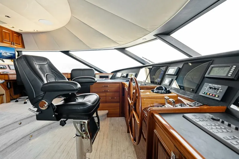 Yes Yacht Photos Pics Luxurious 2011 Westport yacht helm with leather captain's chair and advanced navigation controls.
