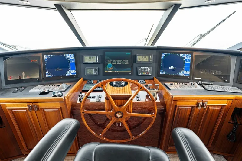 Yes Yacht Photos Pics Pilothouse of 2011 Westport yacht with wooden wheel and advanced navigation systems.
