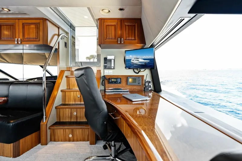Yes Yacht Photos Pics Luxurious 2011 Westport yacht interior with wooden cabinetry, desk, and ocean view.