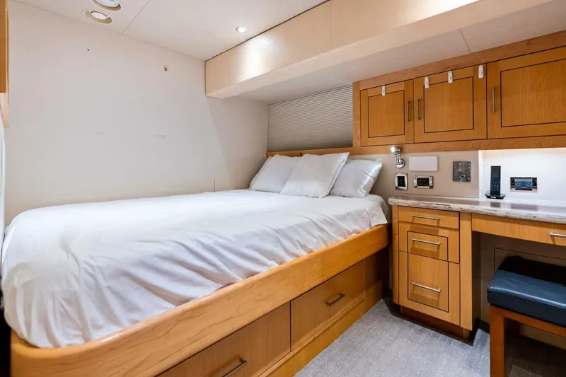 Yes Yacht Photos Pics Luxurious 2011 Westport yacht bedroom with wooden cabinetry and cozy bedding.