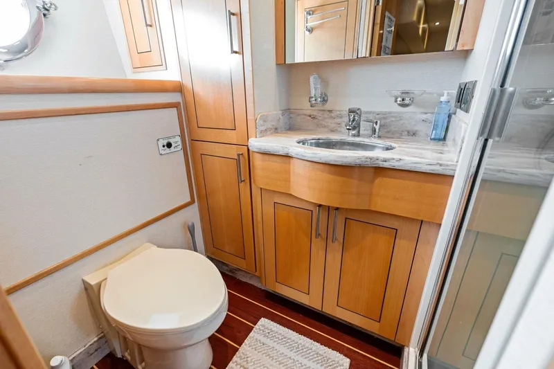 Yes Yacht Photos Pics Luxurious 2011 Westport yacht bathroom with wooden cabinetry and marble countertop.