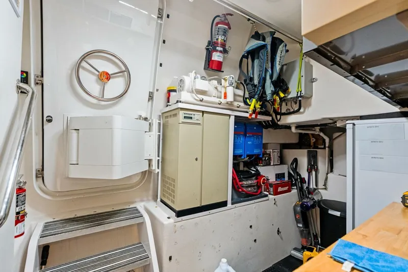 Yes Yacht Photos Pics Utility room in a 2011 Westport yacht with equipment and safety gear.