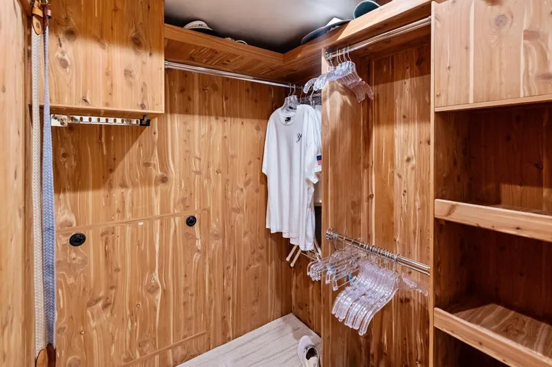 Yes Yacht Photos Pics Wooden walk-in closet with hangers and shelves in a 2011 Westport model.