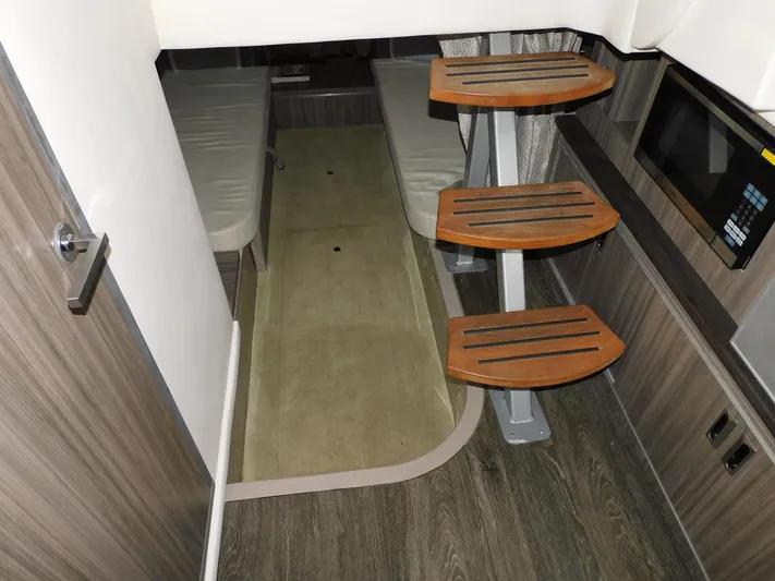 Not Guilty Yacht Photos Pics 2018 Sea Ray Sundancer interior cabin with wooden steps and modern design.