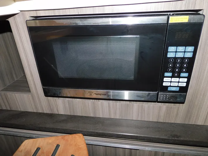 Not Guilty Yacht Photos Pics Built-in microwave in 2018 Sea Ray Sundancer yacht kitchen.
