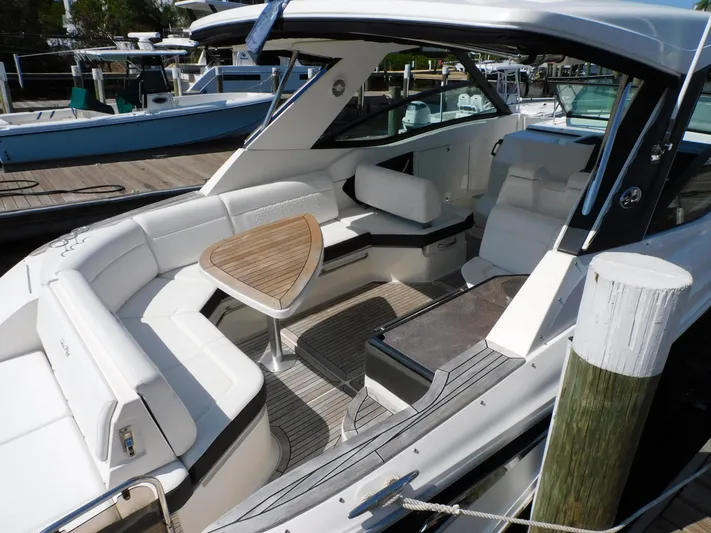 Not Guilty Yacht Photos Pics 2018 Sea Ray Sundancer boat with spacious seating and modern interior at a dock.