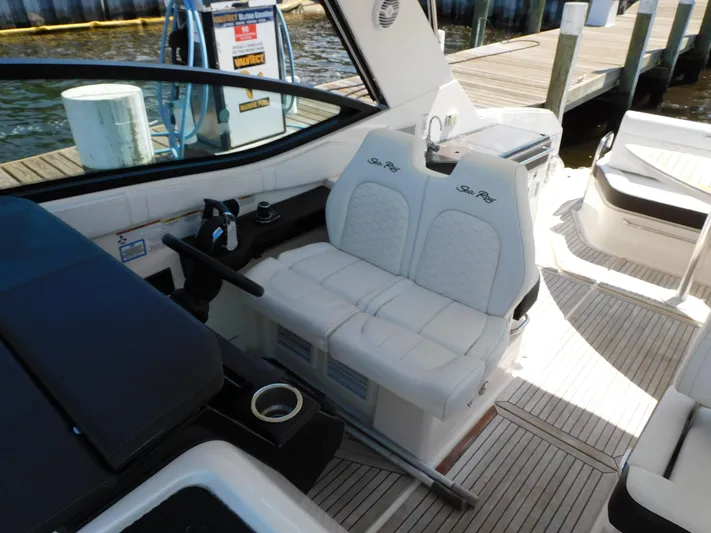 Not Guilty Yacht Photos Pics 2018 Sea Ray Sundancer boat interior with white seating and dock view.
