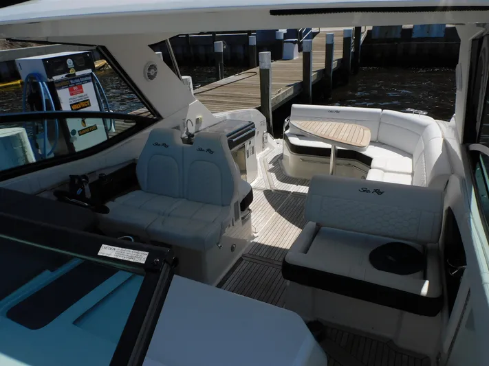 Not Guilty Yacht Photos Pics 2018 Sea Ray Sundancer boat interior with seating and table.