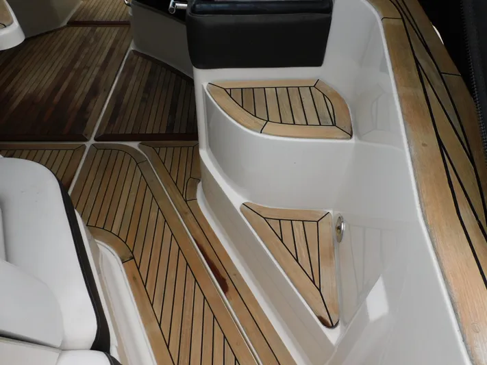 Not Guilty Yacht Photos Pics 2018 Sea Ray Sundancer boat interior with teak flooring and white seating.