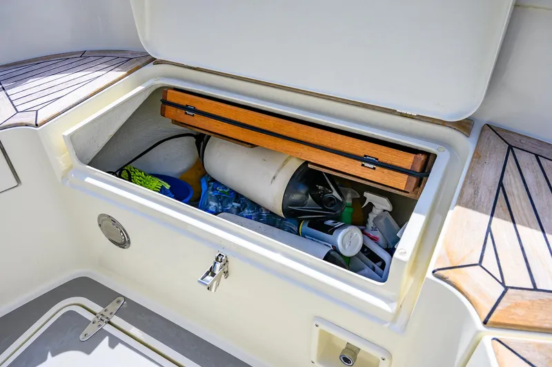  Yacht Photos Pics Storage compartment on 2019 Targa 27.2 boat with cleaning supplies and equipment.