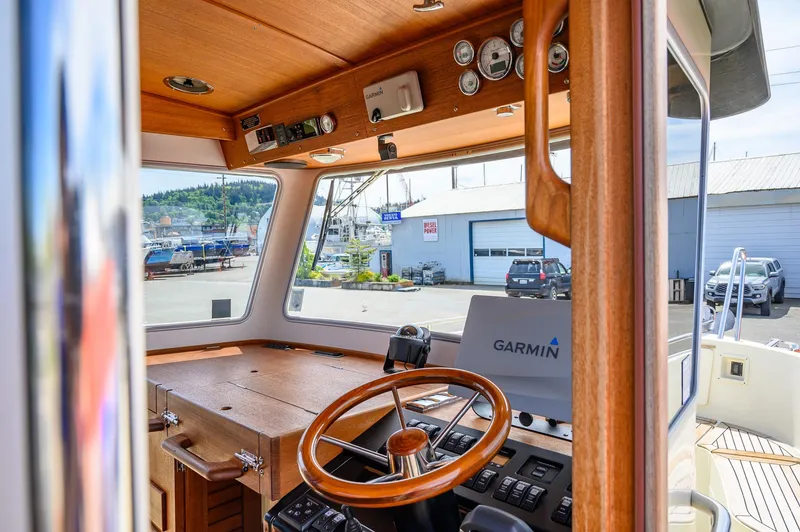  Yacht Photos Pics Interior view of 2019 Targa 27.2 boat cockpit with Garmin navigation system.