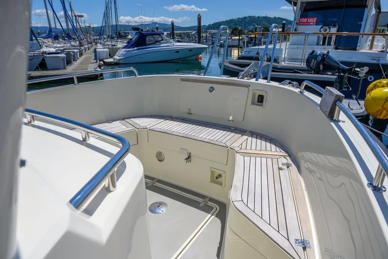  Yacht Photos Pics Targa 27.2 boat deck, 2019 model, docked at marina with clear skies.