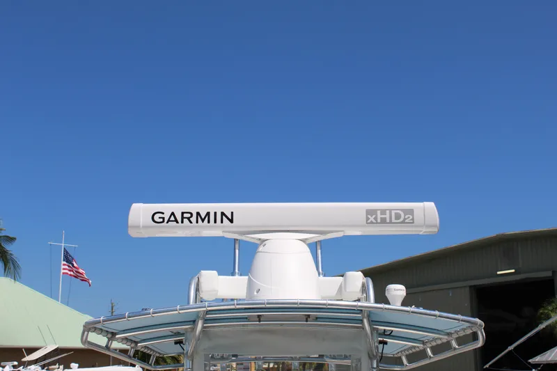  Yacht Photos Pics Contender 31 CC 2002 boat with Garmin xHD2 radar against clear blue sky.