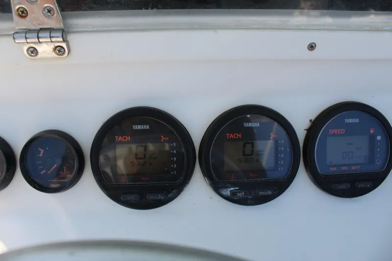 Yacht Photos Pics Dashboard gauges of a 2002 Contender 31 CC boat, featuring Yamaha tachometers and speedometer.