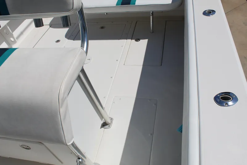  Yacht Photos Pics 2002 Contender 31 CC boat interior with white seating and deck details.