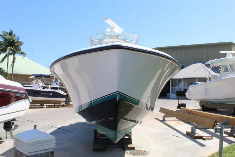  Yacht Photos Pics 2002 Contender 31 CC boat on display in a marina setting.