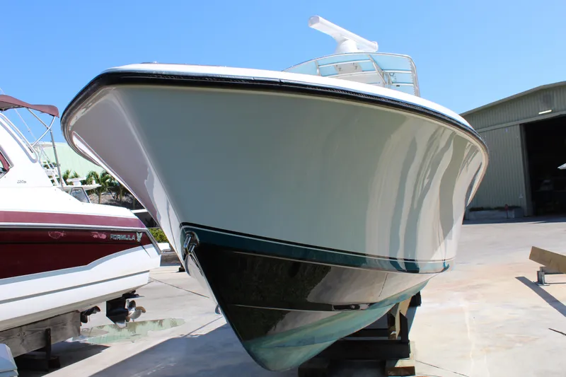  Yacht Photos Pics 2002 Contender 31 CC boat on dry dock, front view.