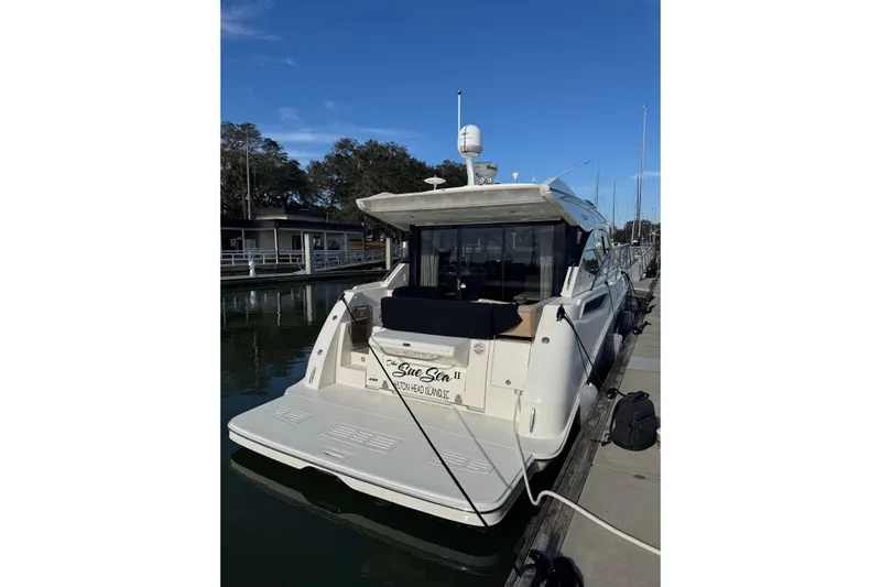  Yacht Photos Pics 2017 Sea Ray Sundancer 400 yacht docked at marina under clear blue sky.