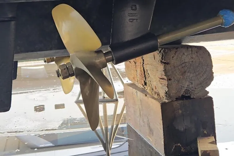  Yacht Photos Pics Propeller of 2017 Sea Ray Sundancer 400 on wooden blocks during maintenance.