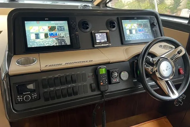  Yacht Photos Pics Control panel of 2017 Sea Ray Sundancer 400 yacht with dual screens and steering wheel.