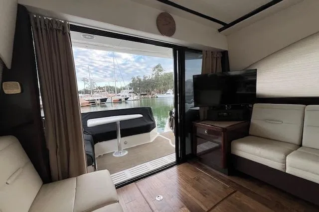  Yacht Photos Pics Interior view of 2017 Sea Ray Sundancer 400 yacht with modern seating and waterfront view.