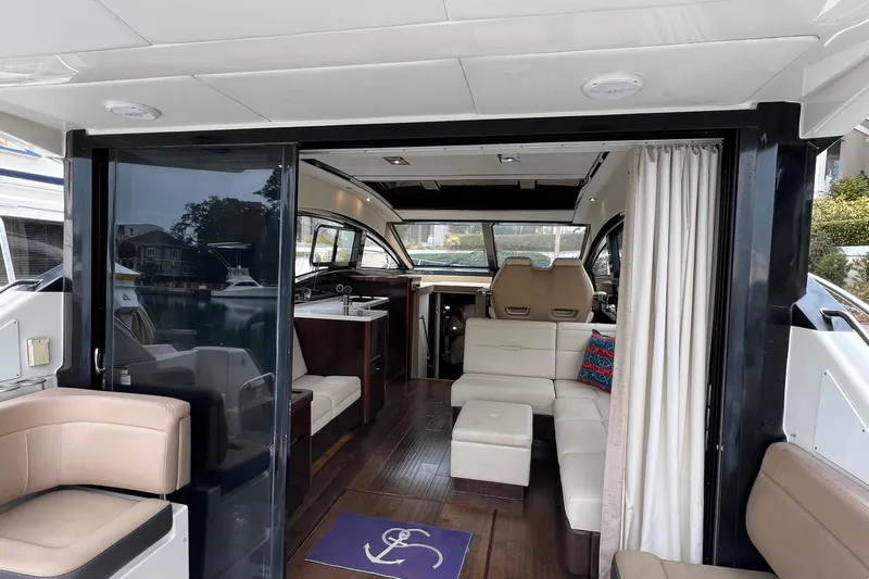  Yacht Photos Pics Luxurious interior of 2017 Sea Ray Sundancer 400 yacht with modern seating and decor.