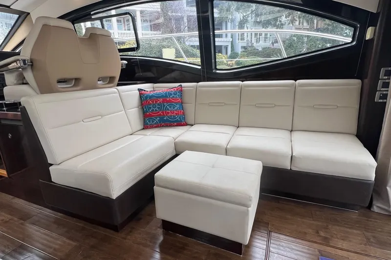  Yacht Photos Pics Luxurious interior of 2017 Sea Ray Sundancer 400 yacht with white leather seating.