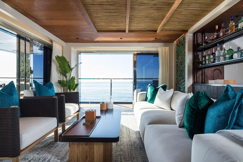 King Benji Yacht Photos Pics Luxurious 2024 Dunya Yachts Explorer interior with ocean view, elegant seating, and stylish decor.