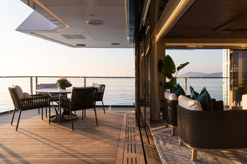 King Benji Yacht Photos Pics Luxurious 2024 Dunya Yachts Explorer deck with elegant seating and ocean view.