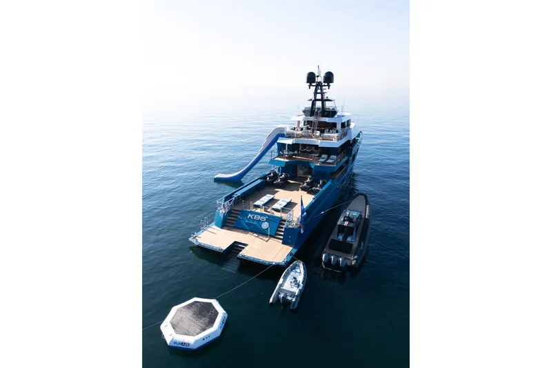 King Benji Yacht Photos Pics 2024 Dunya Yachts Explorer with slide and tenders on calm sea.
