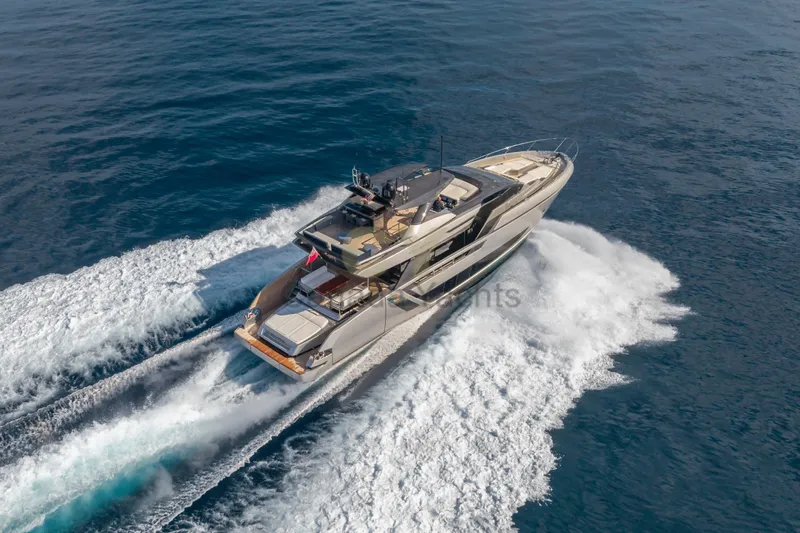 Allora Yacht Photos Pics Luxurious 2026 Riva 82' Diva yacht cruising on open sea.