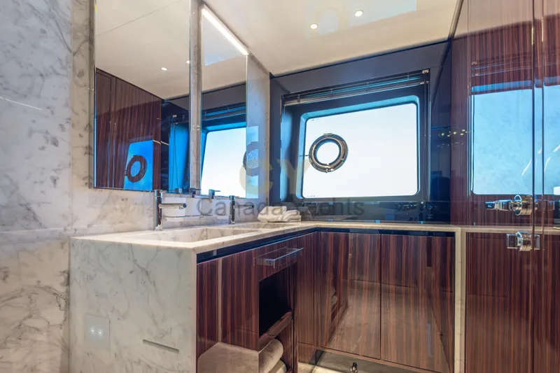 Allora Yacht Photos Pics Luxurious bathroom interior on 2026 Riva 82' Diva yacht with marble and wood finishes.