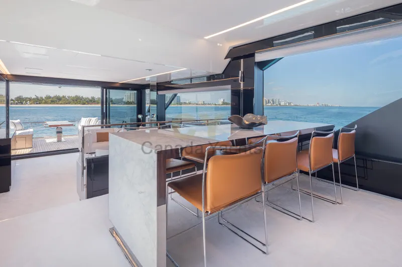 Allora Yacht Photos Pics Luxurious interior of 2026 Riva 82' Diva yacht with ocean view and modern seating.