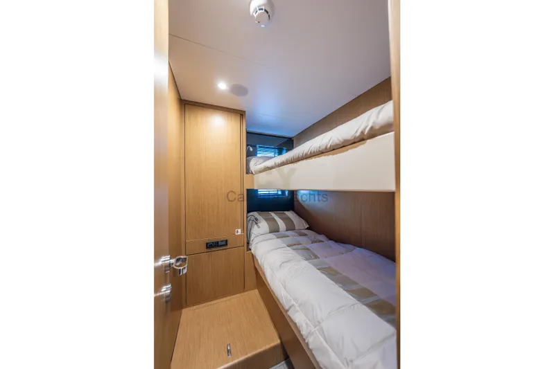 Allora Yacht Photos Pics Bunk beds in the 2026 Riva 82' Diva yacht cabin, featuring modern wood paneling.