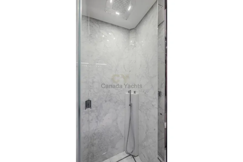 Allora Yacht Photos Pics Luxurious marble shower in 2026 Riva 82' Diva yacht bathroom.