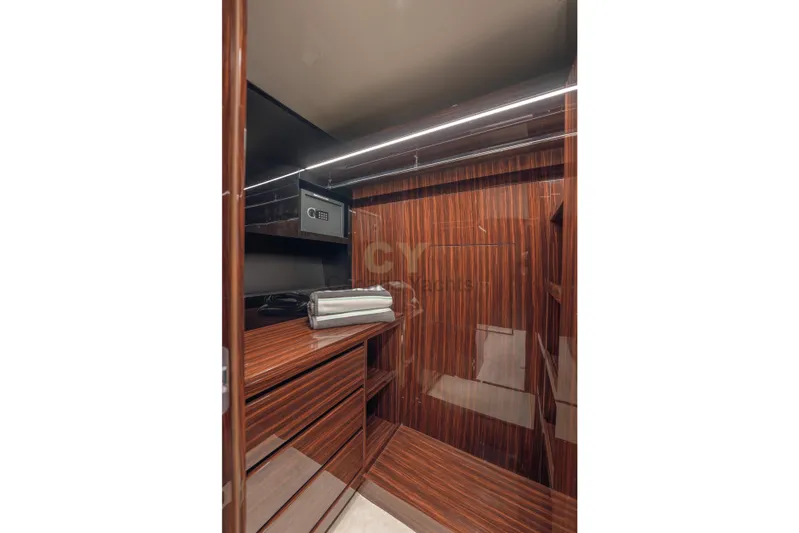 Allora Yacht Photos Pics Luxurious wooden interior of 2026 Riva 82' Diva yacht with safe and storage.