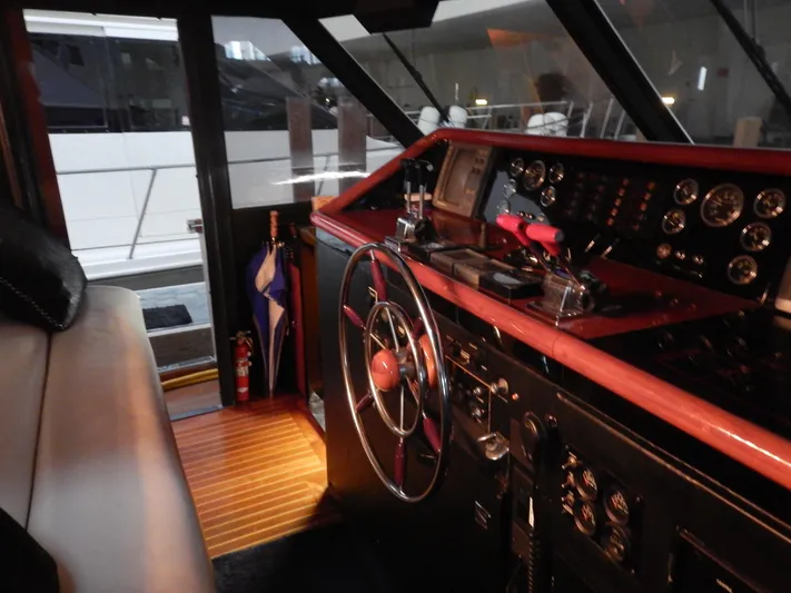 Top Coat Yacht Photos Pics 1974 Pacemaker Cockpit Motoryacht interior with classic steering wheel and control panel.