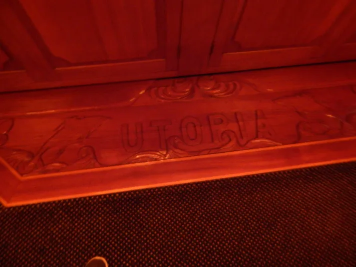 Top Coat Yacht Photos Pics Carved wooden panel with "UTOPIA" on a 1974 Pacemaker Cockpit Motoryacht.