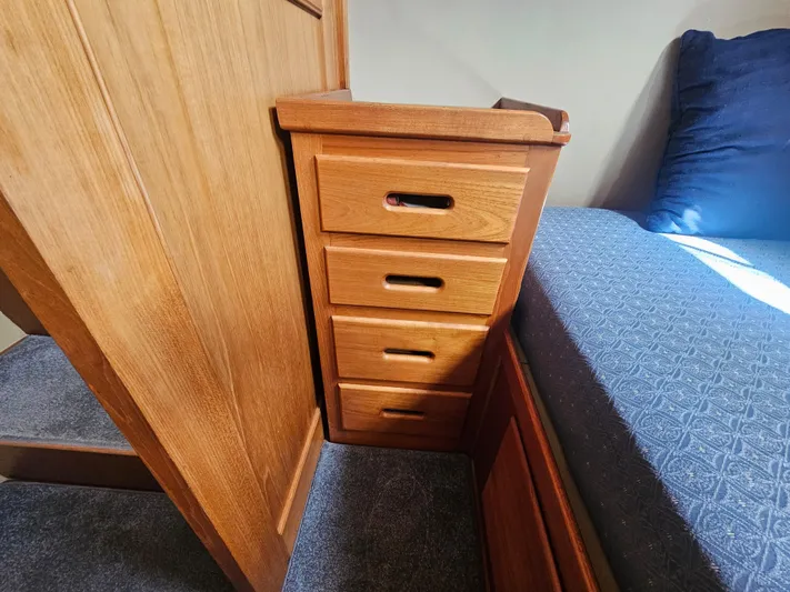 Marytime Yacht Photos Pics Wooden drawers beside bed in 1987 Grand Banks 42 Europa yacht interior.