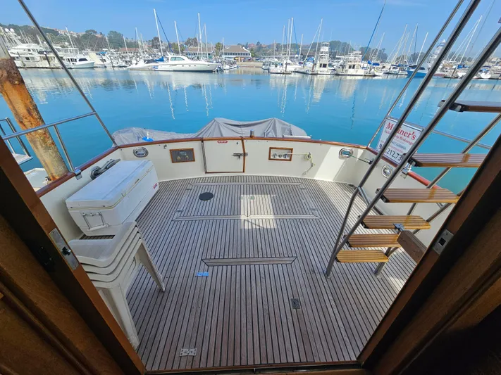 Marytime Yacht Photos Pics Grand Banks 42 Europa 1987 yacht deck overlooking marina with boats.