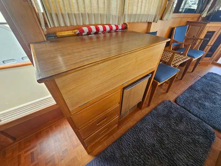 Marytime Yacht Photos Pics Interior of 1987 Grand Banks 42 Europa yacht with wooden cabinetry and seating area.