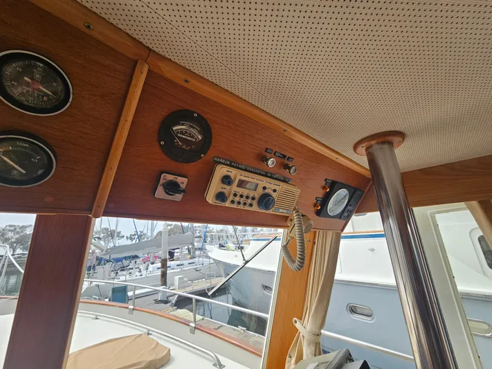 Marytime Yacht Photos Pics Interior view of 1987 Grand Banks 42 Europa yacht with control panel and gauges.