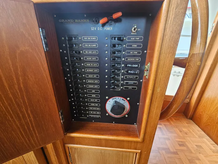Marytime Yacht Photos Pics Electrical panel of a 1987 Grand Banks 42 Europa yacht, featuring 12V DC power controls.