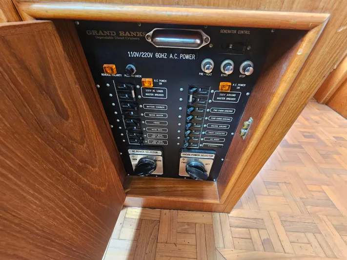 Marytime Yacht Photos Pics Electrical panel of 1987 Grand Banks 42 Europa yacht, showcasing power controls and switches.