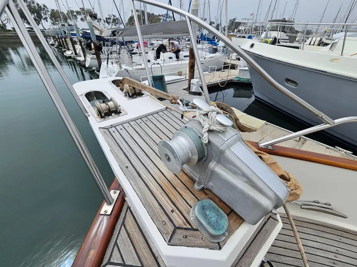 Marytime Yacht Photos Pics 1987 Grand Banks 42 Europa yacht deck with winch, docked in marina.