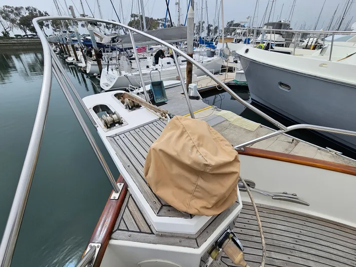 Marytime Yacht Photos Pics 1987 Grand Banks 42 Europa yacht docked at marina, showcasing deck and railing details.