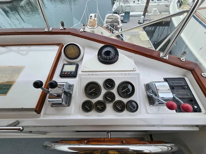 Marytime Yacht Photos Pics Helm of 1987 Grand Banks 42 Europa with gauges and controls, docked at marina.