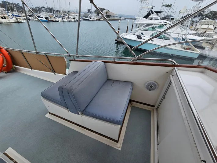 Marytime Yacht Photos Pics 1987 Grand Banks 42 Europa yacht deck with seating, overlooking marina.