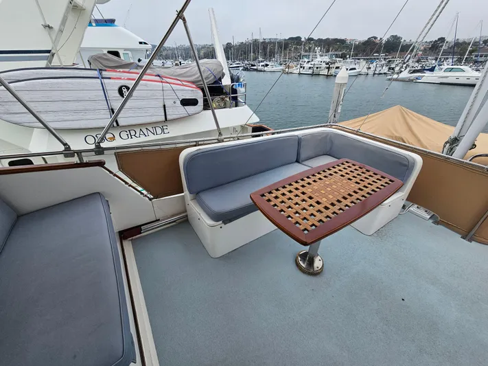 Marytime Yacht Photos Pics Outdoor seating area on a 1987 Grand Banks 42 Europa yacht, docked at a marina.